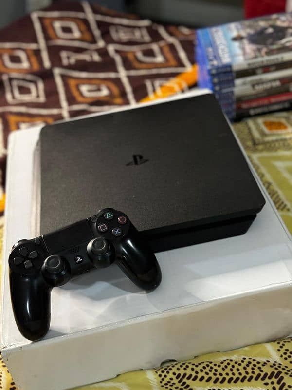 PS4 Slim with 2 controllers with 8 original games 1