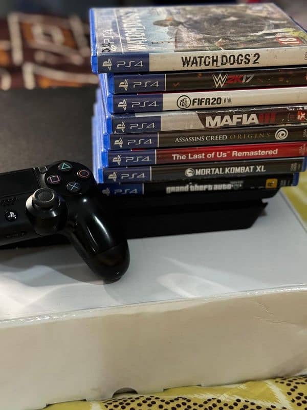 PS4 Slim with 2 controllers with 8 original games 3