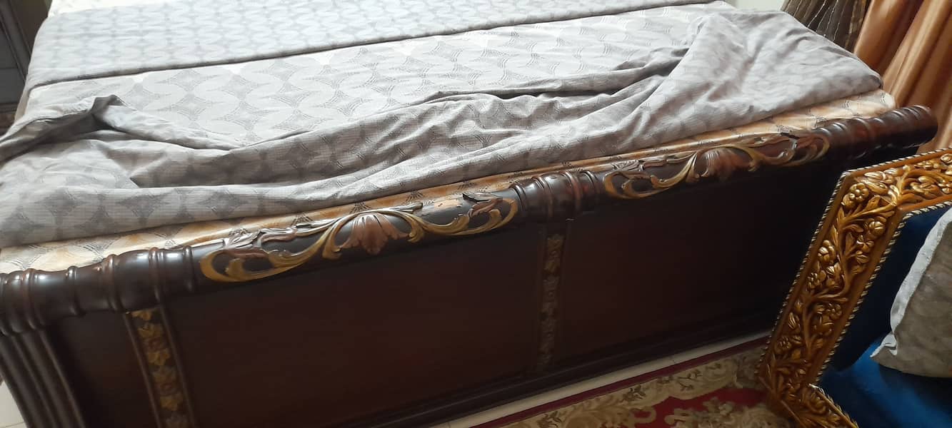 Beautifully carved wooden king sized bed and 2 side tables 1