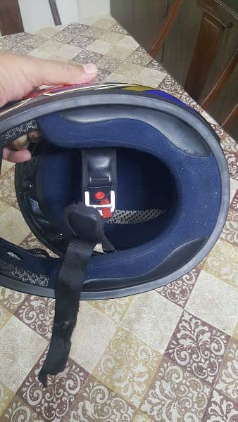 'TAKACHI'Thiland Branded motorcycle helmet. Size, Small. hi 5