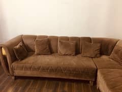 L shape sofa with brass on sides