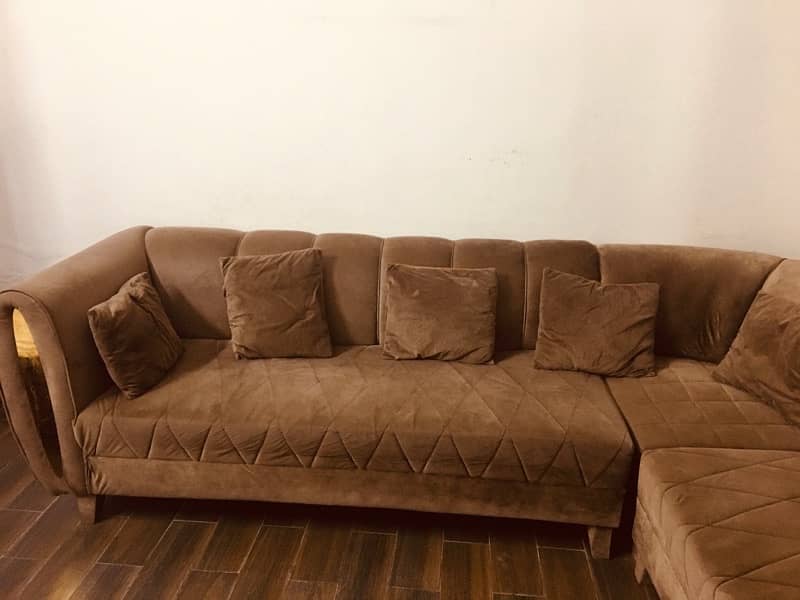 L shape sofa with brass on sides 0