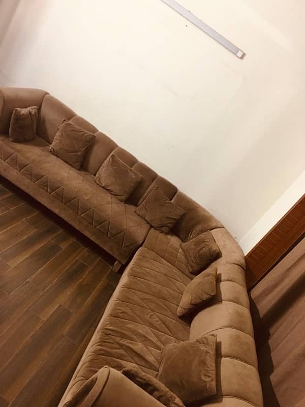 L shape sofa with brass on sides 1