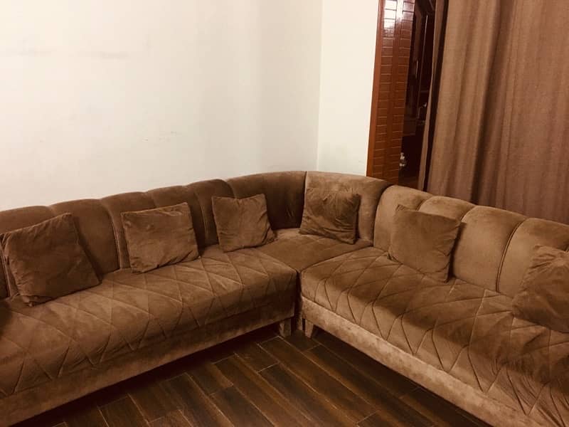 L shape sofa with brass on sides 3