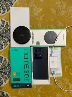 infinix NOTE 30 Pro with wireless charger box and complete accessories