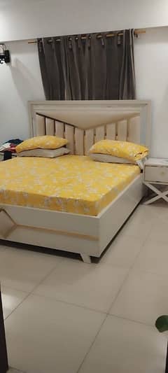 king size bed with 2 side table