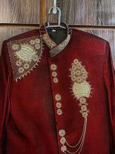 RED VELVET SHIRWANI WITH KHUSAA AND KULLA AND OFFWHITE SILK SUITE