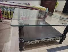 wooden center table with glass