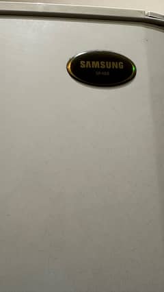 Samsung refrigerator in ash white color with good cooling condition