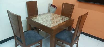 Very less used Dinning table with Four chairs