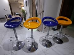 Swinging colourfull chairs