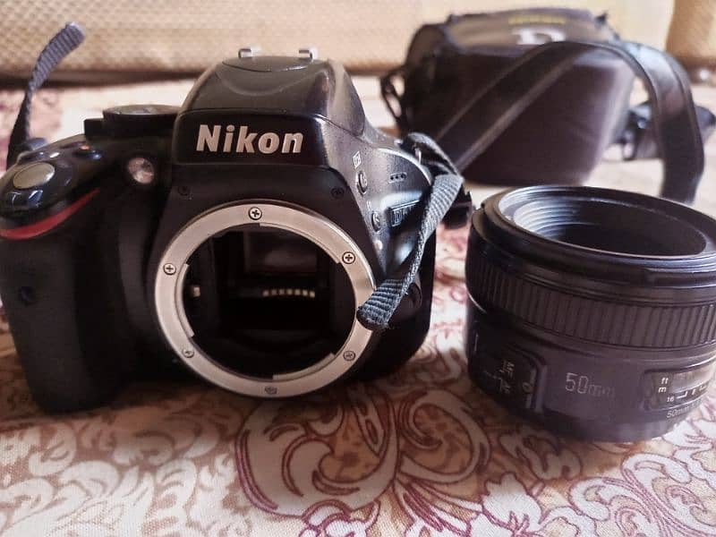 Nikon D5100 (with 50mm youngo lense) 3