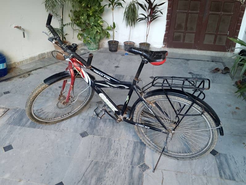 boys bicycle in a good condition with removable backseat 0