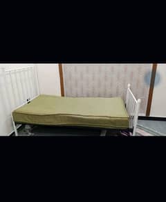 single iron bed and spring mattress