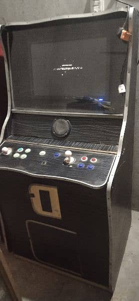 2 video games and one hand ball with extra buttons 0