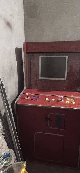 2 video games and one hand ball with extra buttons 1