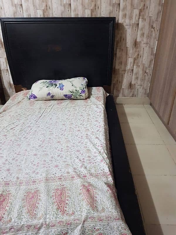 Single wooden bed low lying 1