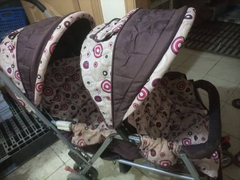 twin pram . double seat front back for 2 kids available 4