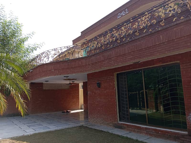 1 Kanal Beautiful House with 5 Beds and huge car parking is available for Rent in DHA Phase 4 ,Lahore 1