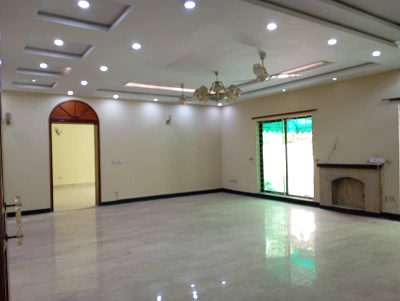 1 Kanal Beautiful House with 5 Beds and huge car parking is available for Rent in DHA Phase 4 ,Lahore 6