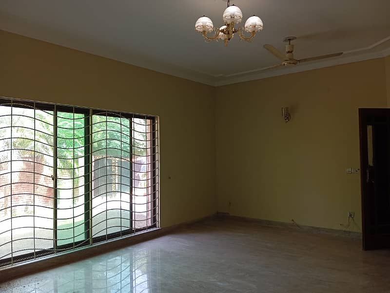 1 Kanal Beautiful House with 5 Beds and huge car parking is available for Rent in DHA Phase 4 ,Lahore 14