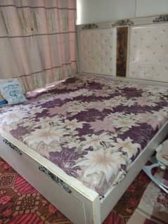 wooden bed and wardrob