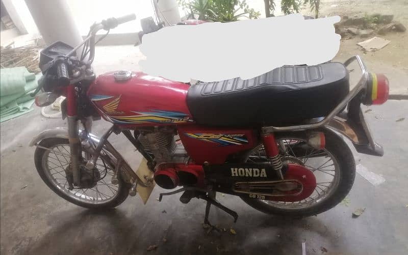 Honda cg 125 swabi reg 2 original plate number file copy by hand. 1