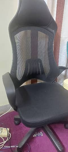 Computer chair with head rest.