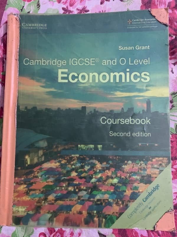 O level Economics Second edition by Susan Grant and topical past paper 0