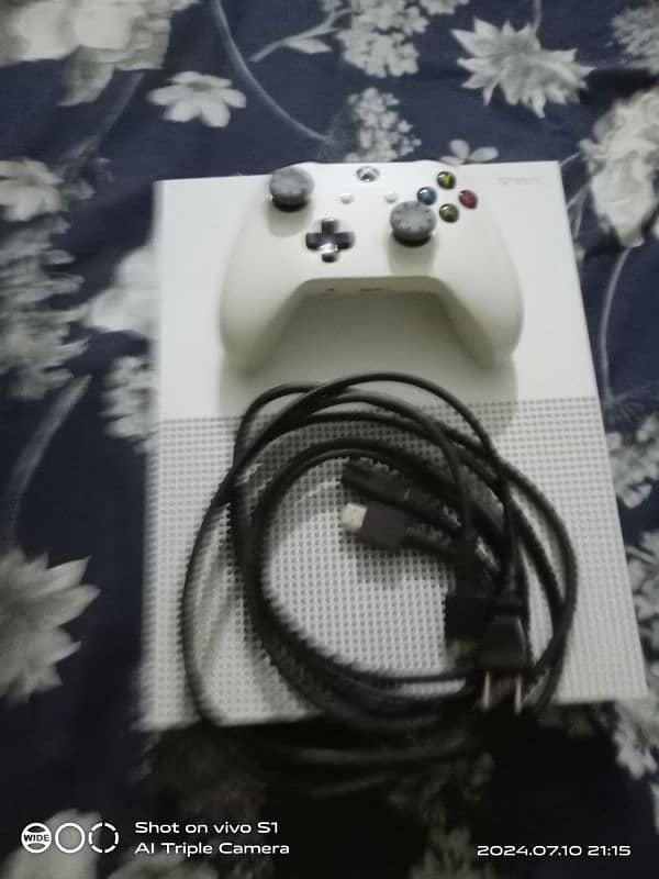 a xbox one s with controler and 14game 11