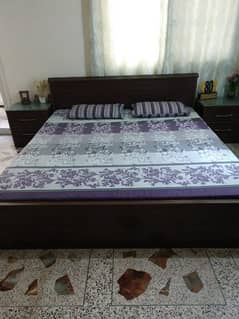 king size bed with 2 side tables, 1 cupboard, 1 dressing table