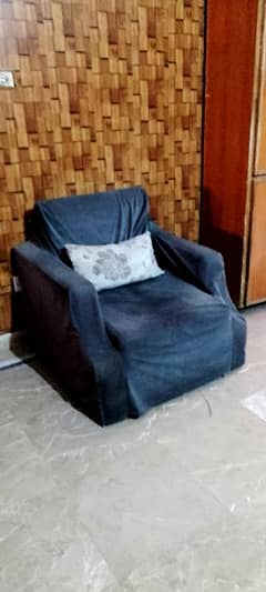 Grey and black velvet sofa set with cushions and grey covers