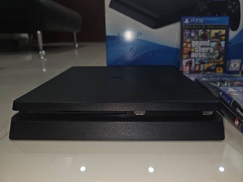 PS4 Slim 1TB –SSD, 3 Controllers, 4 Physical Games 10