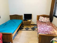 2 single beds with centeral daraz