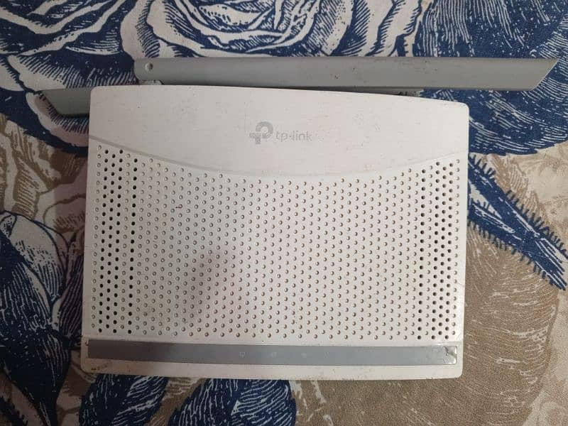 tp link router with charger and internet wire 1