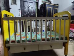 wooden baby cot is available for sale