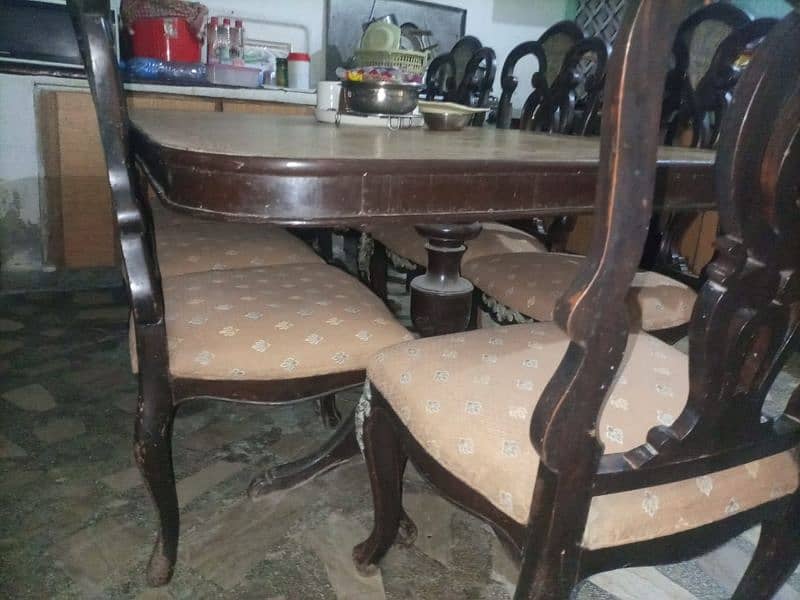 Dining table with 8 chairs seats 2