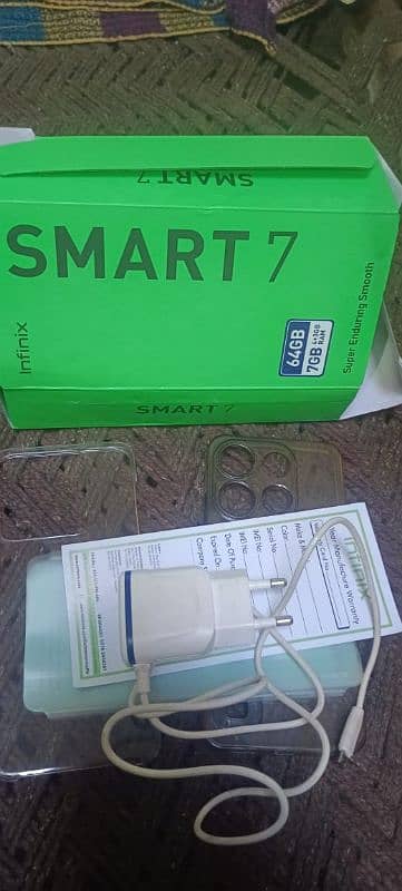 infinix smart 7 with box and charger 7