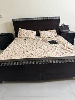 Double bed with mattress and side tables