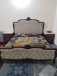 double bed with dressing table and side tables