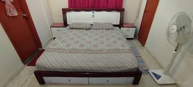 King size double bed with two side tables