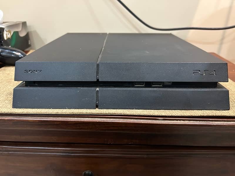 ps4 with 2  discs and 2 controllers 7