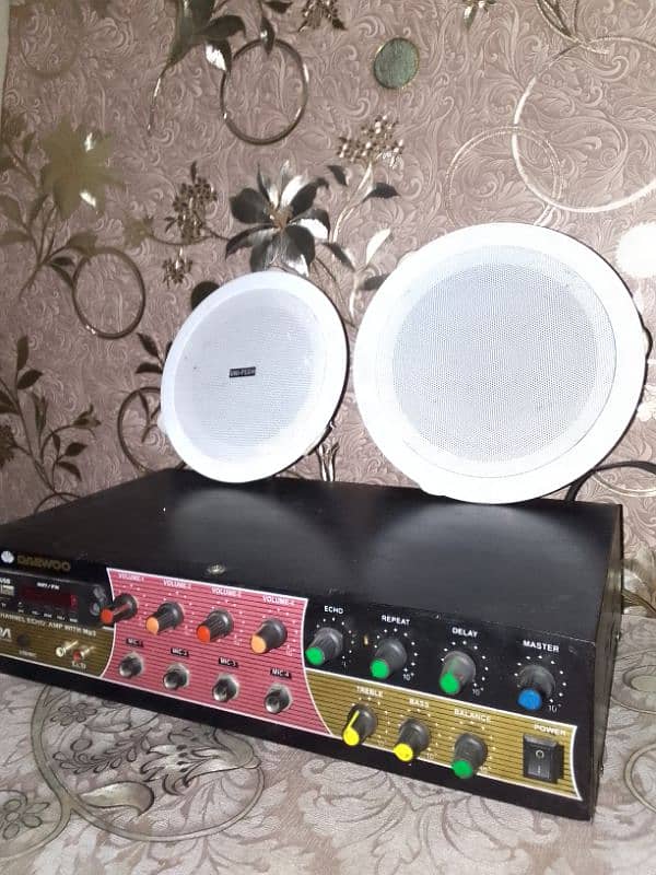 4 ceiling speaker with amplifier. . . almost new condition. . . 0