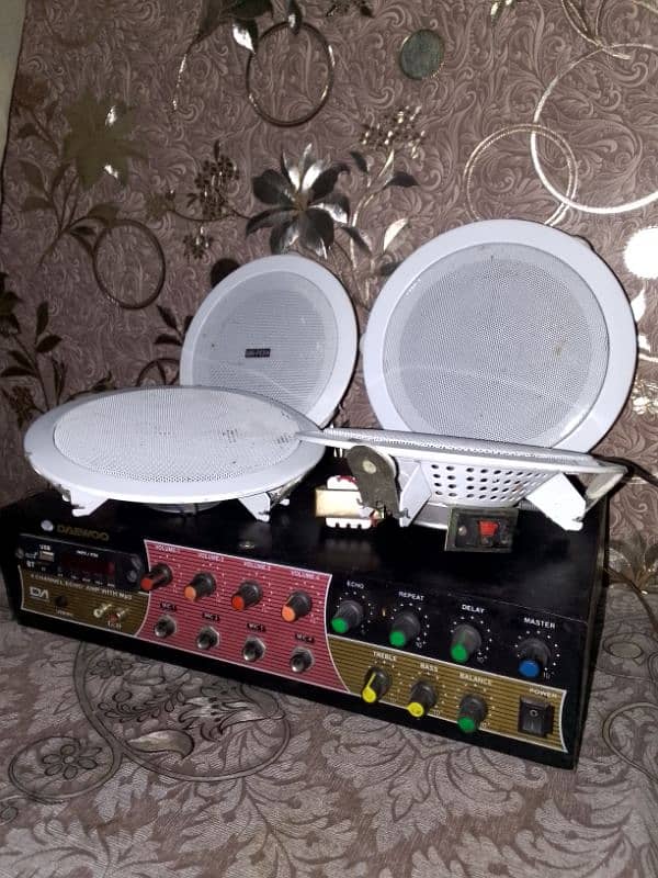 4 ceiling speaker with amplifier. . . almost new condition. . . 1