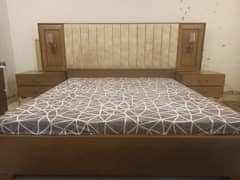 wooden double bed with dressing table and side tables