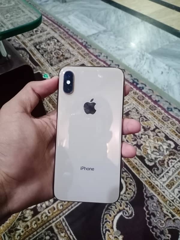 iPhone Xs with charger 2