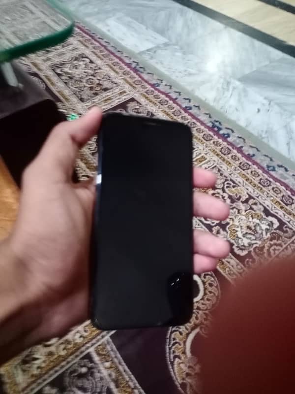 iPhone Xs with charger 4