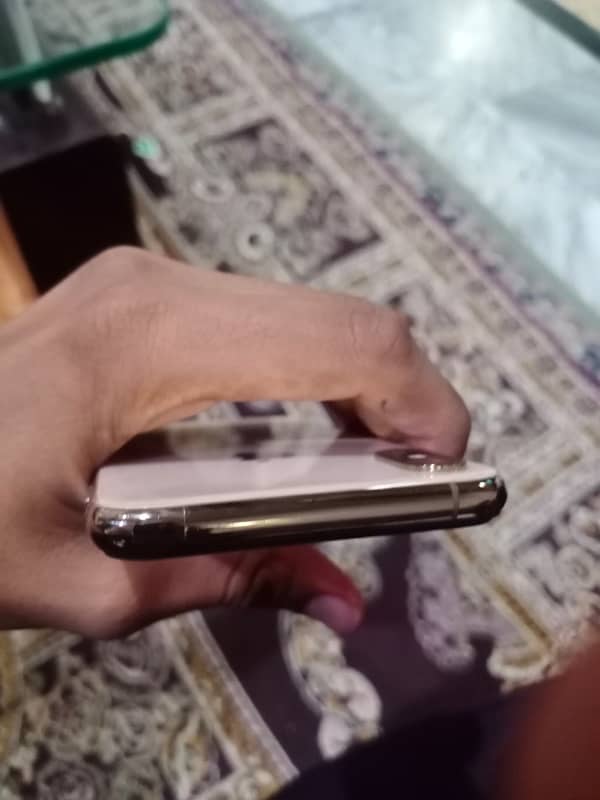 iPhone Xs with charger 9