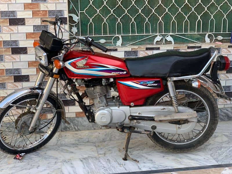 Honda 125 red colour good condition chakwal number ma all documents ok 0