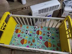 wooden baby cot is available for sale